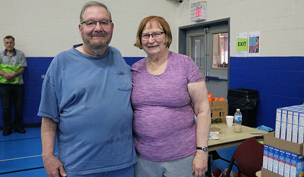 Laddie and Kathy volunteer at an Older Adult Choice Market in Berwyn