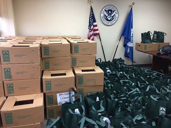 Boxes of food and bags of produce for TSA workers at Midway.