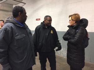 Kate Maehr talks to Darrell English, a TSA officer.