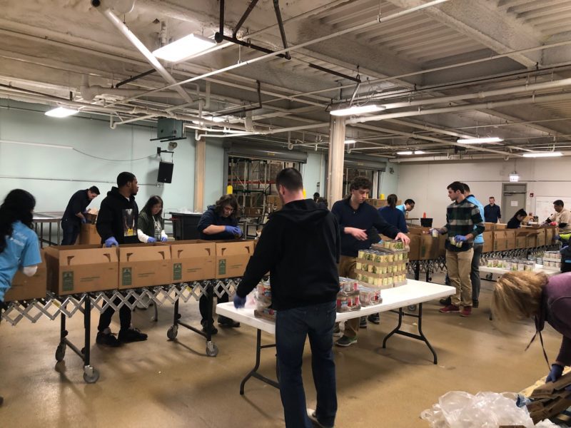 Volunteers pack boxes for furloughed federal workers.