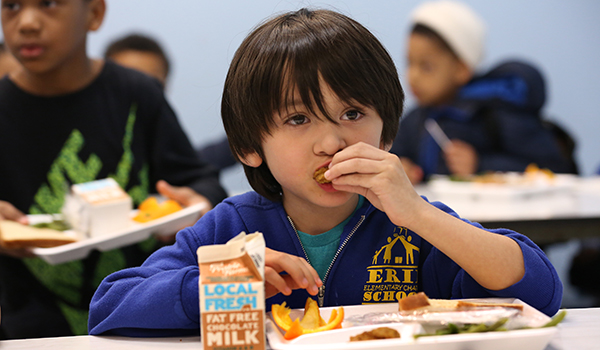 A child eats at the Barreto club in Humboldt Park.