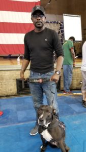 Jonathan Cooper and his dog, Mira, at the Standdown.