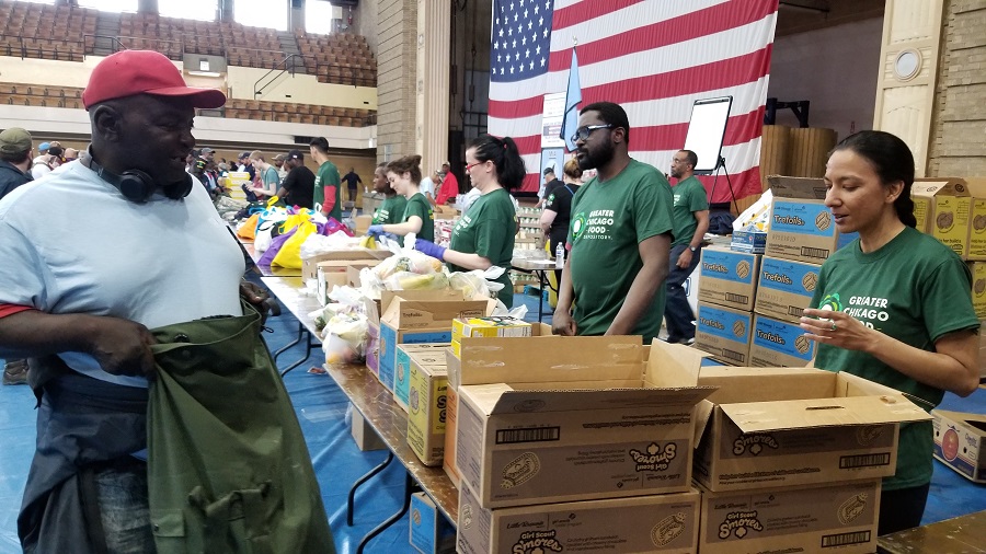 Food Depository volunteers give fresh produce to veterans at the Standdown.