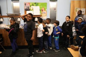 Kids line up to eat.