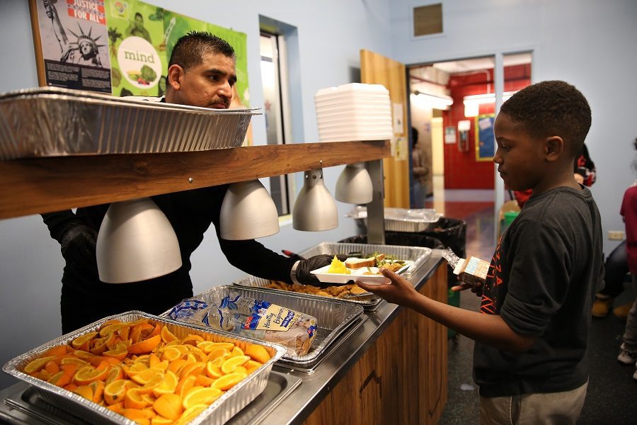 A boy receives his afterschool meal at the Barreto club.