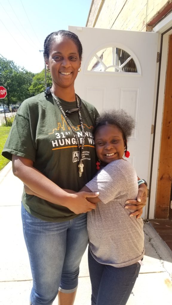 New Life Covenant Southeast food pantry coordinator Jackie Kabir, pictured with her 8-year-old daughter Aziza.