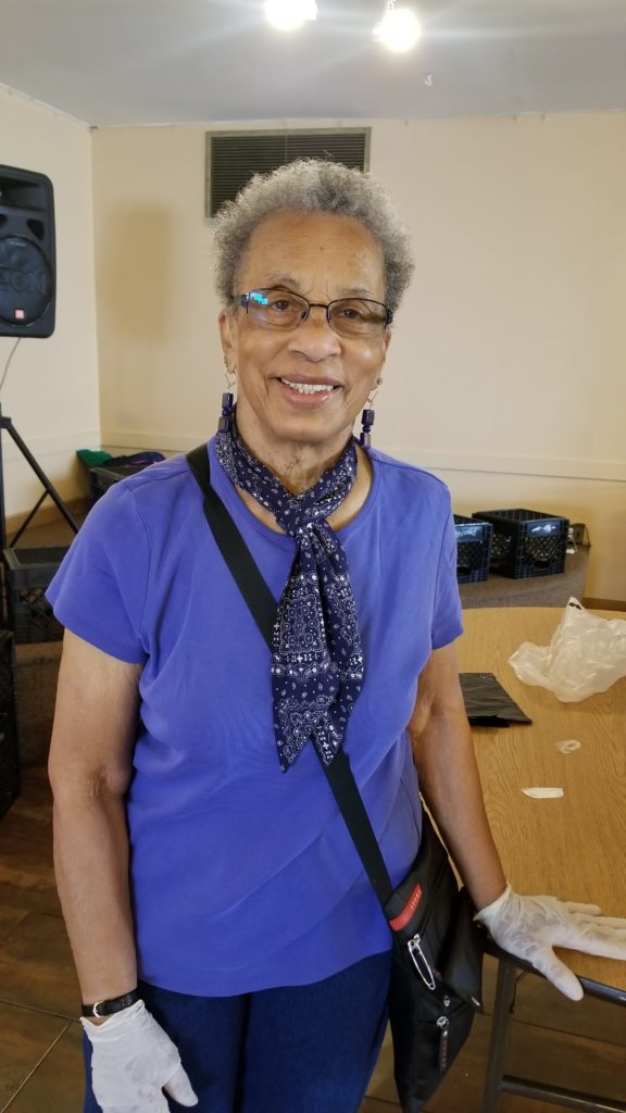 Madeline Gantt, known at the New Life Covenant Southeast food pantry as simply "Mama Gantt," gives a hug to everyone who comes into the pantry.