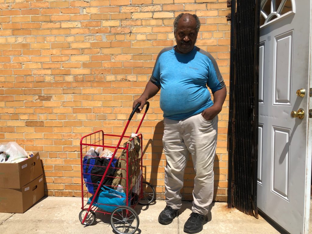 William McKenzie, 70, stands outside of the New Life Covenant Southeast food pantry in Grand Crossing. 