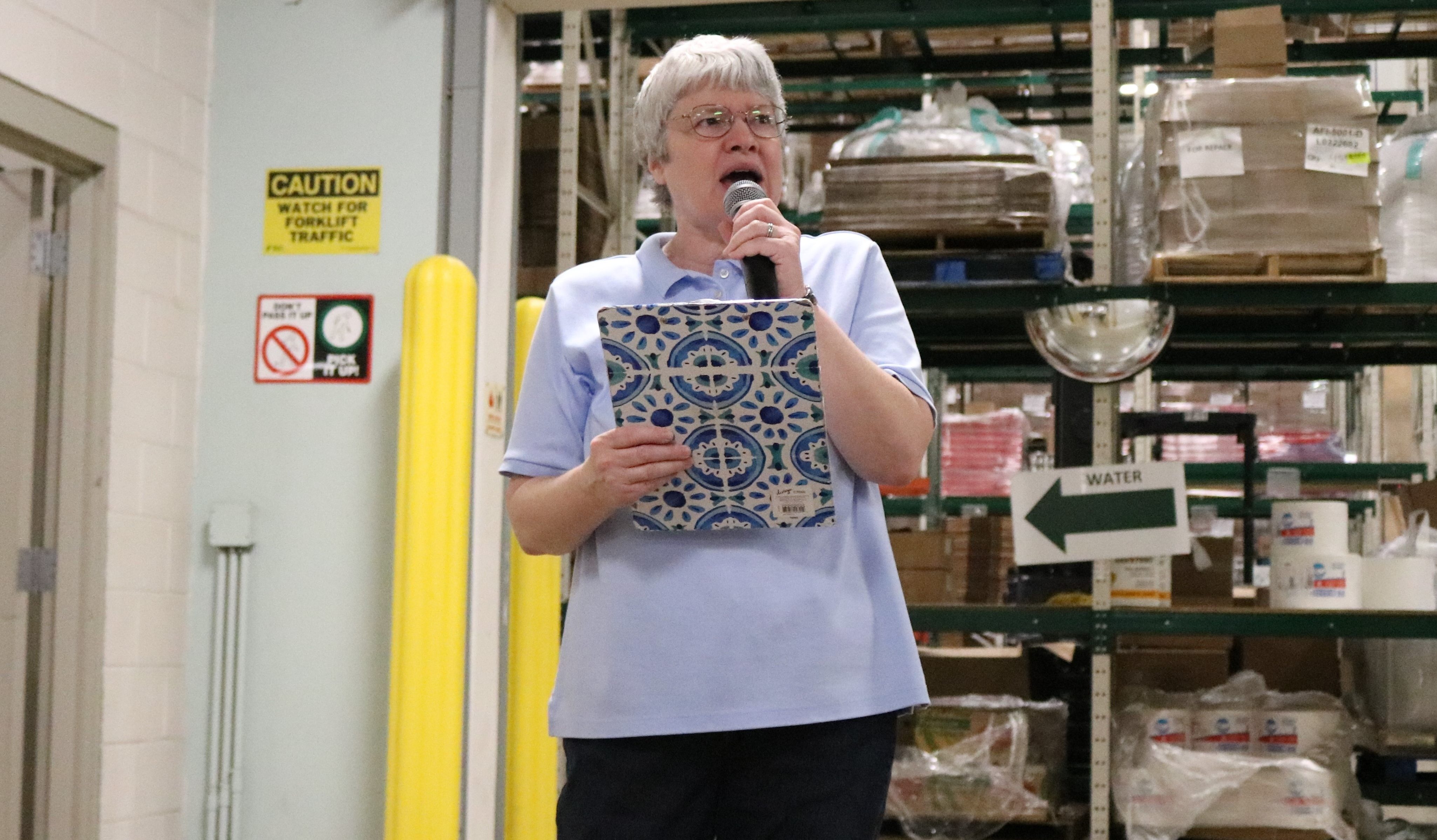 Janet Andersen, the Food Depository's manager of volunteer engagement, leads a repack session