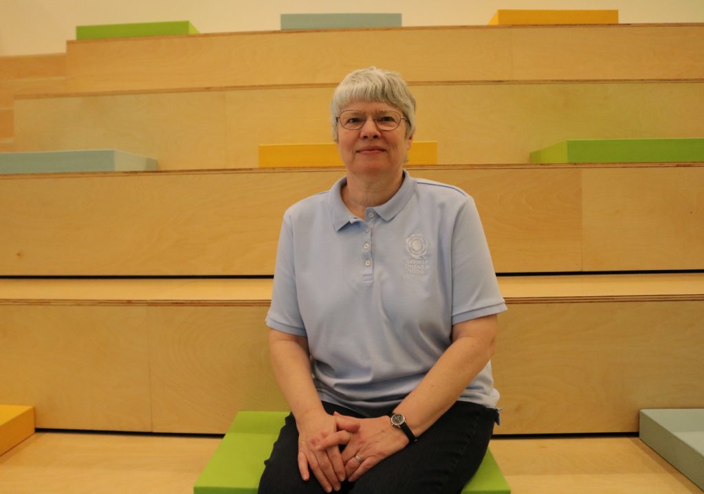 Janet Andersen, the Food Depository's manager of Volunteer Engagement, sits in the new volunteer orientation room.