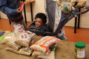 Baby at food pantry smiles