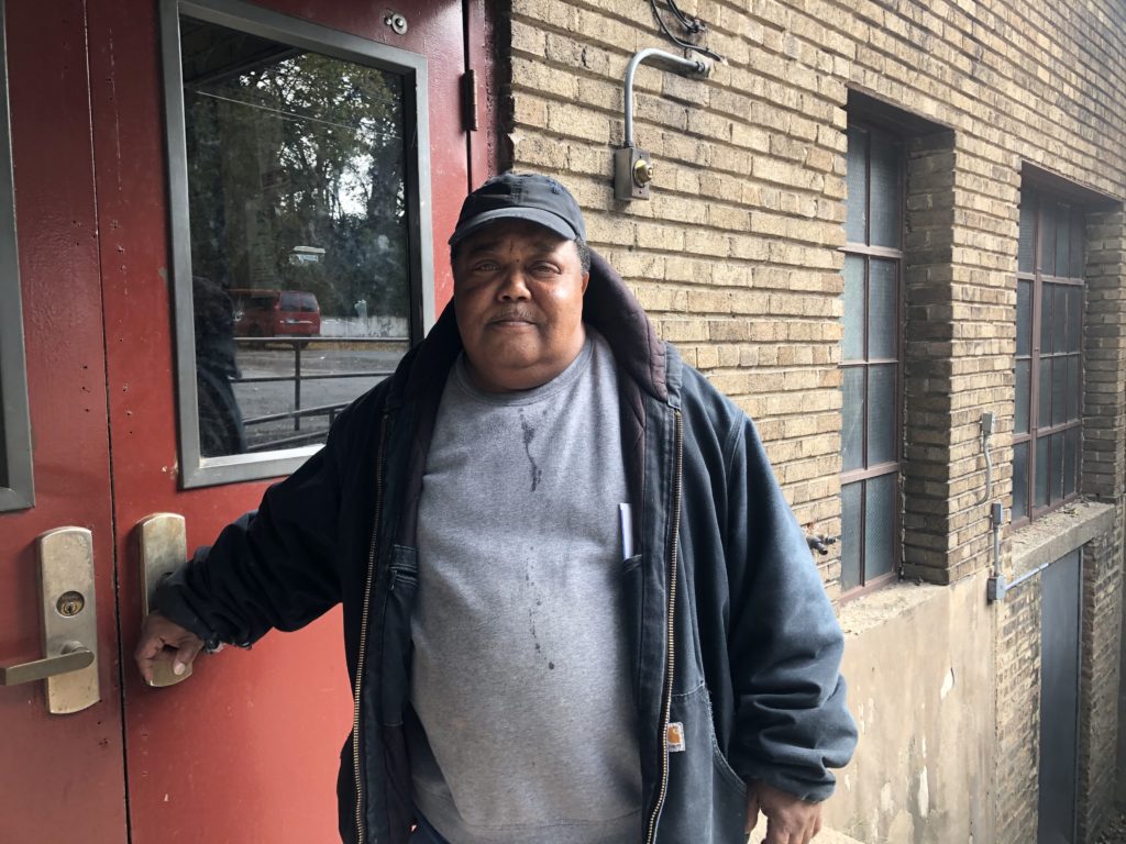 Vincent Owens, a longtime pantry volunteer, poses for a photo