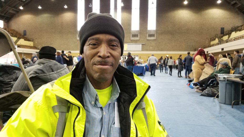 Army veteran Norman Hall poses for a photo at the Chicago Standdown. Hall turned to community support services, including his neighborhood pantries, after a car accident left him unable to work. 