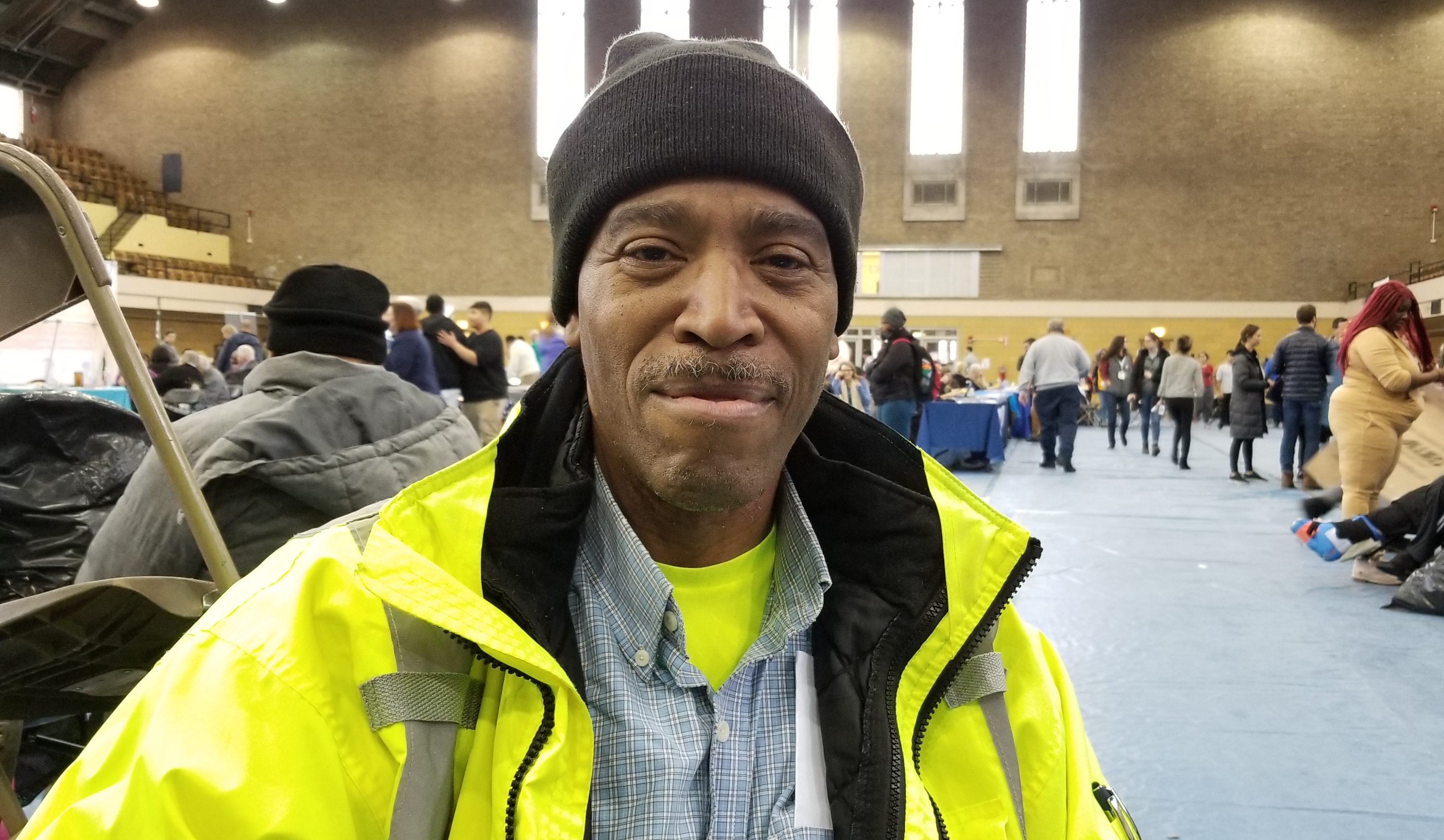 Army veteran Norman Hall poses for a photo at the Chicago Standdown. Hall turned to community support services, including his neighborhood pantries, after a car accident left him unable to work.