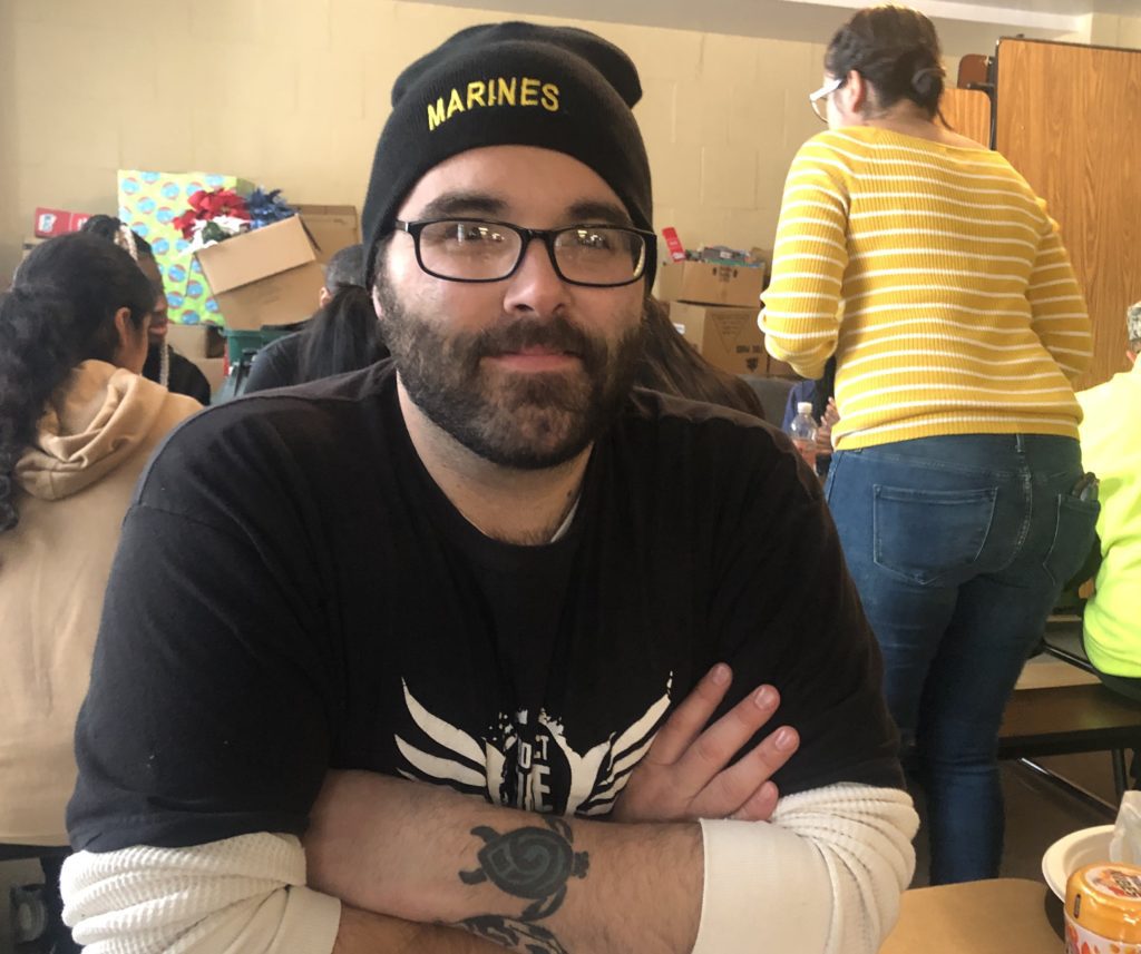 Marines Corps veteran Tyler Hanyzewski poses for a photo at the Chicago Standdown