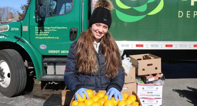 Angelika Kwak, a member of the Hunger Action Corps, at a FRESH Truck distribution in Chicago Heights