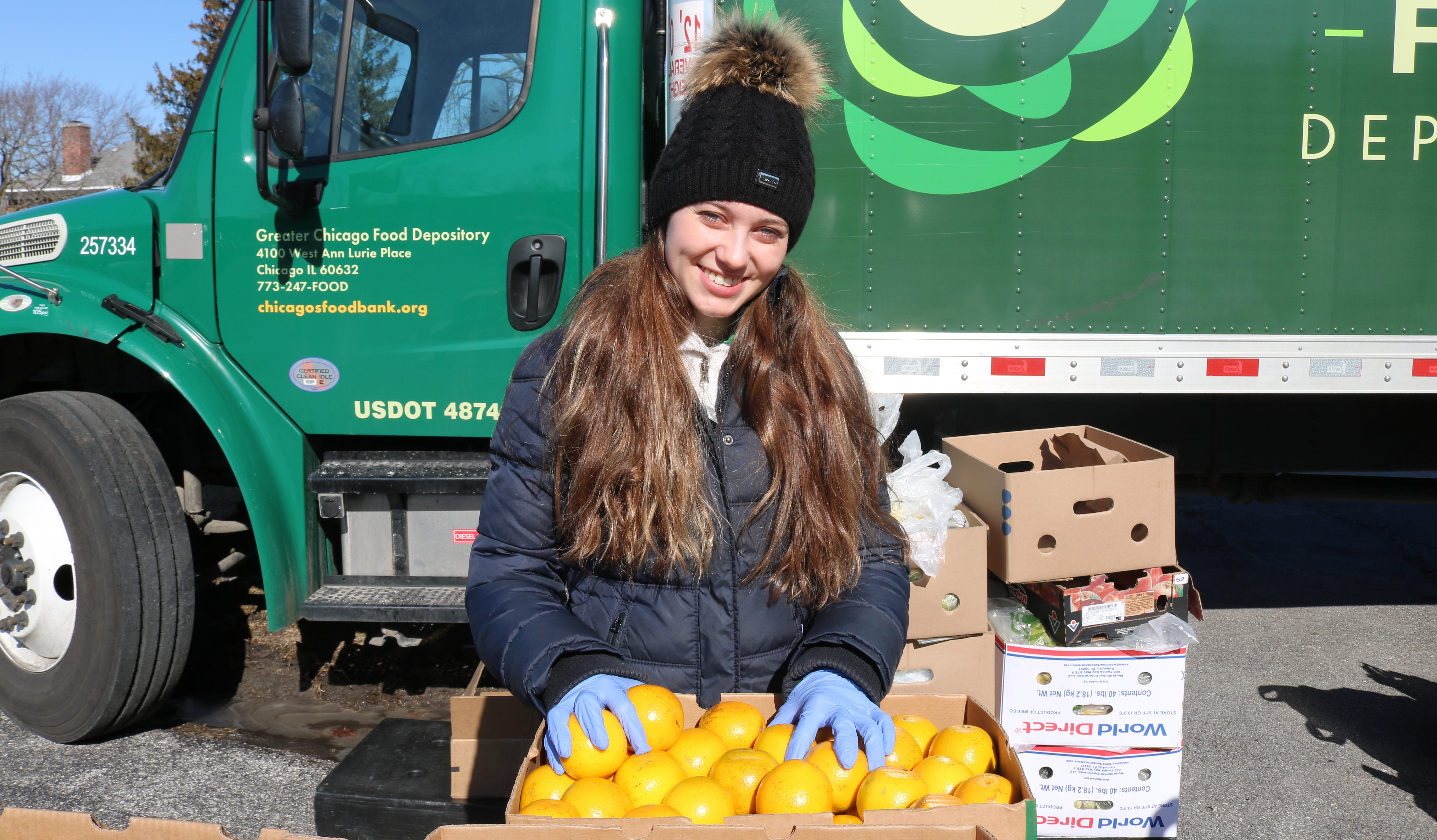 Angelika Kwak, a member of the Hunger Action Corps, at a FRESH Truck distribution in Chicago Heights