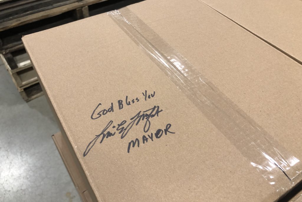A box signed by Mayor Lori Lightfoot in the Greater Chicago Food Depository warehouse that states: 'God bless you'
