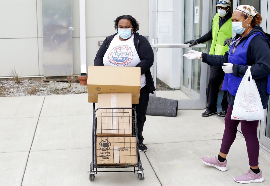 Jacquietta Jones receives food at the Trinity United Church of Christ 