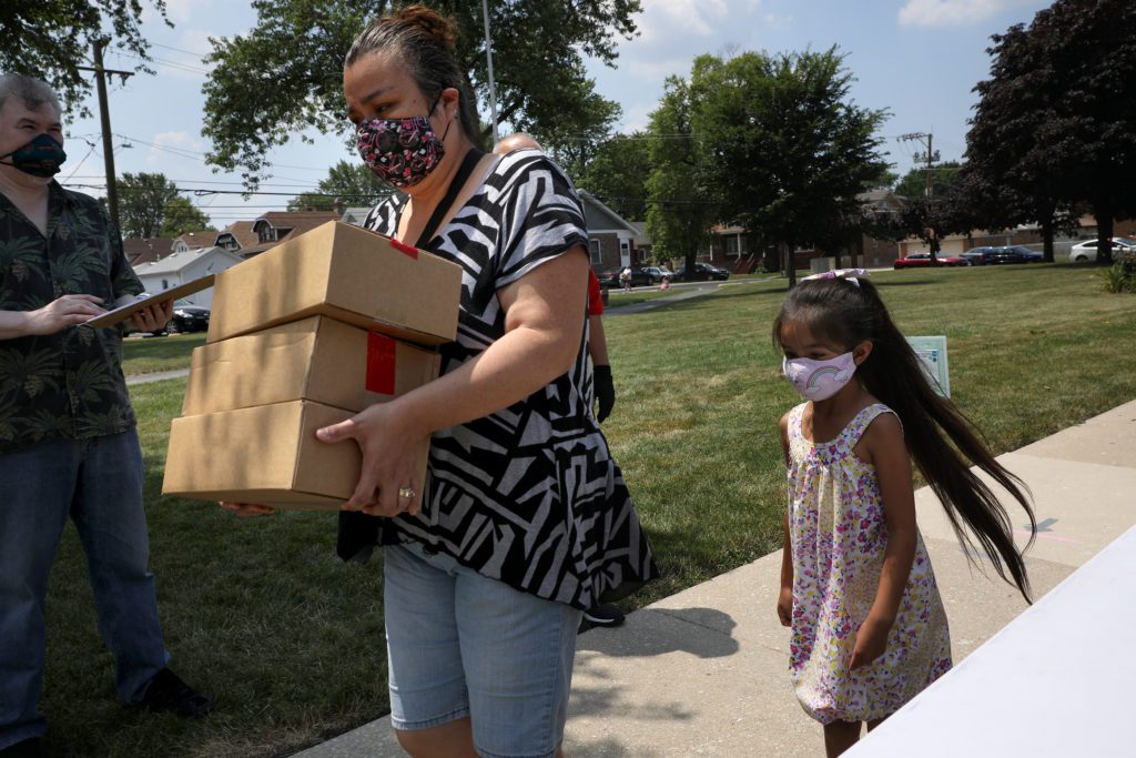 Jeanette and Janelle Calderon pick up meals from the Lunch Bus