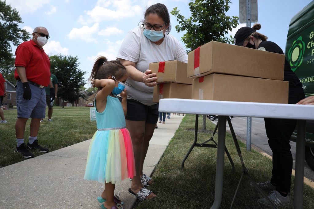 Three-year-old Lila with her grandmother Maria Moreno, at the Berwyn Lunch Bus