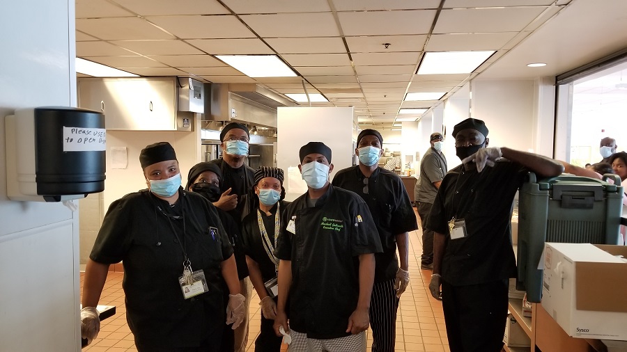 Chef Marshall and his culinary team at A Safe Haven pose for a portrait.