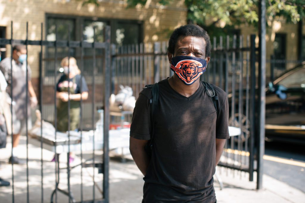 Damien Copening waits outside at the Providence Soup Kitchen