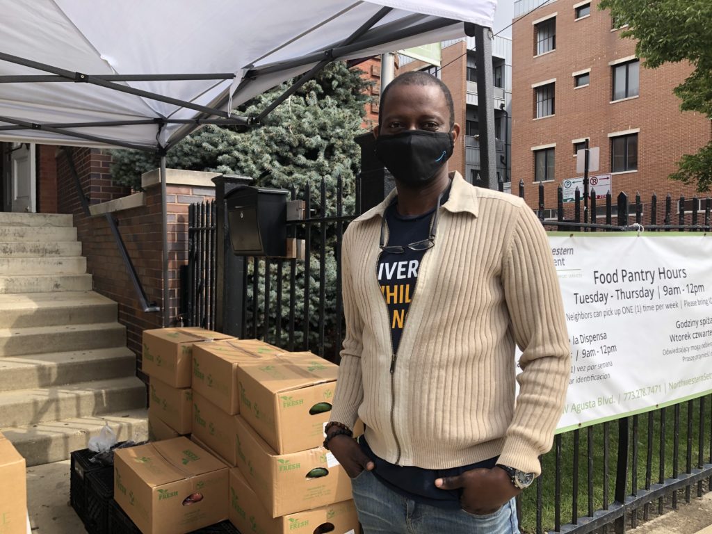 Samson Chukwuemekae poses for a photo at the Northwestern Settlement food pantry