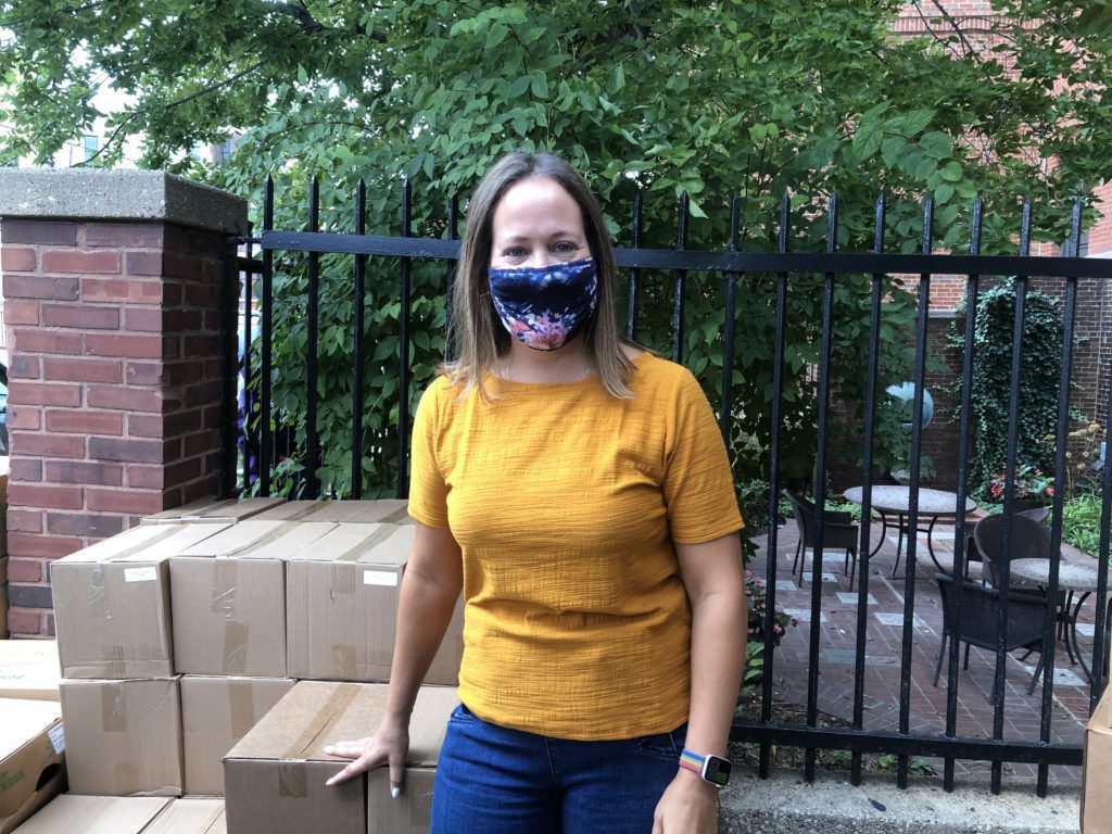 Yasmin Rodriguez,, Northwestern Settlement’s director of family and emergency services, stops for a photo during its outdoor food distribution