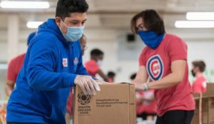Young ballplayers, family members and coaches with Cubs Charities packed nearly 40,000 pounds of food for families in need.