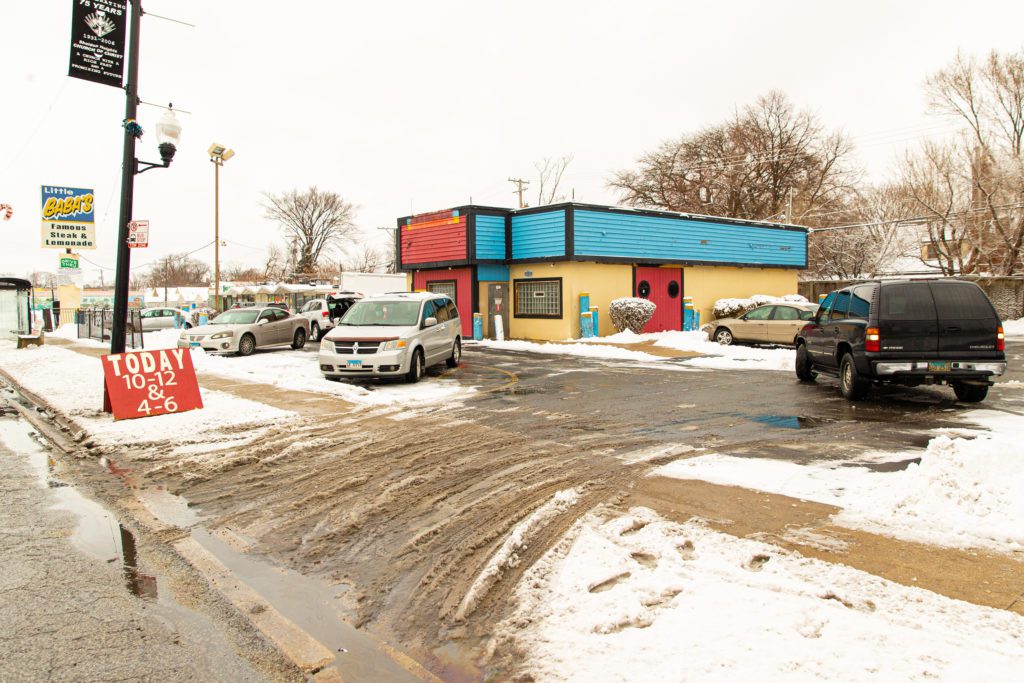 The exterior of the Sheldon Heights food pantry on a distribution day in January 2021. With new grant funding, pantry leaders hope to install new, permanent signage and a canopy on the side of the building to protect visitors from the elements as they wait in line.