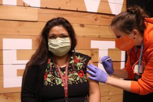 Cecilia Cap receives the coronavirus vaccine.