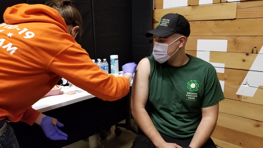 Xavier Hernandez receives the first dose of the COVID-19 vaccine.