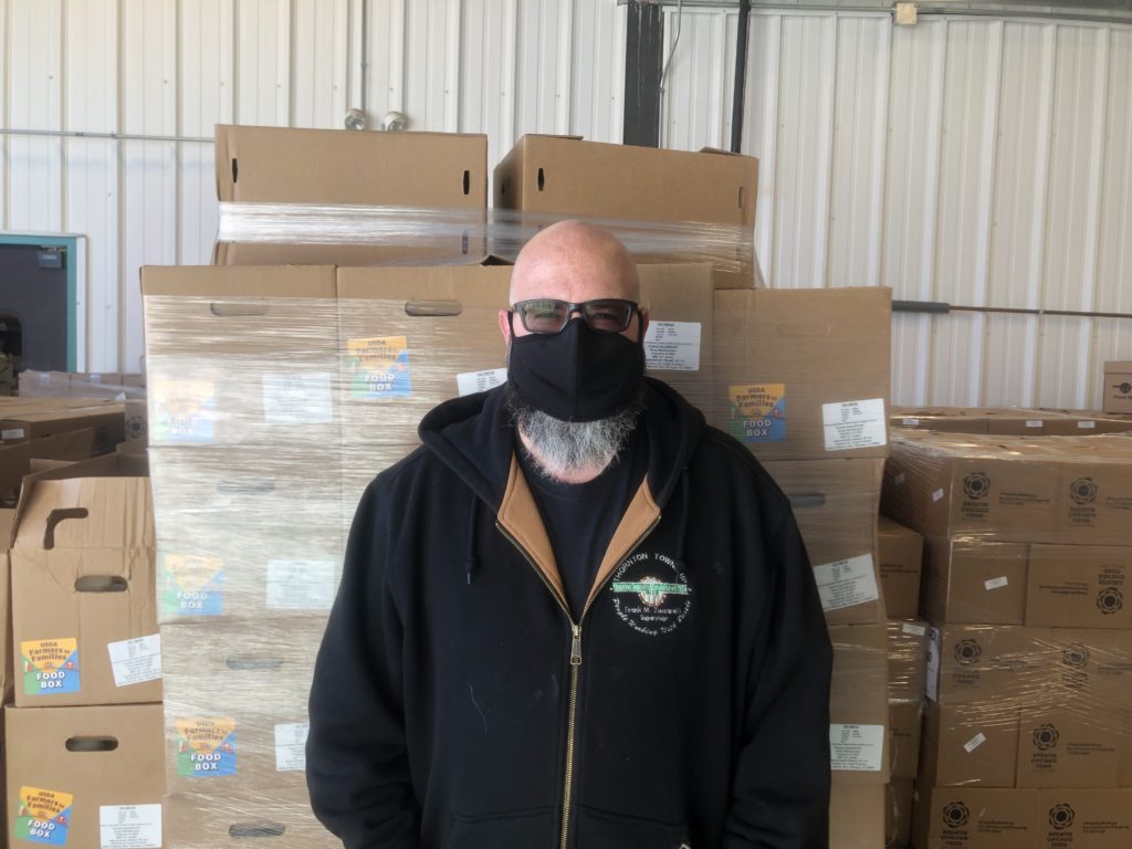 Troy OQuin, Thornton Township's manager of general assistance, poses for a photo during its food pantry distribution