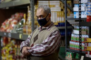 Volunteer Darran Cathey waits to help the next pantry guest.