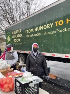 Donna Mitchell at a Fresh Truck distribution in the snow on April 20. (Photo courtesy of Donna Mitchell)
