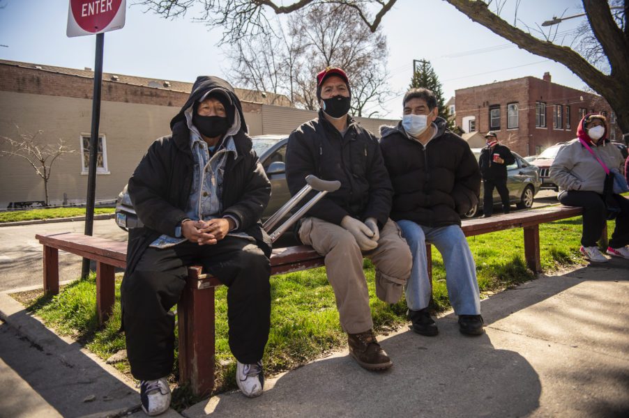 Jose, Mario and Martin patiently waiting for Amor de Dios doors to open. (Photos taken by Caro Sanchez)