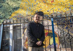 Pastor Ramiro Rodriguez with mural 