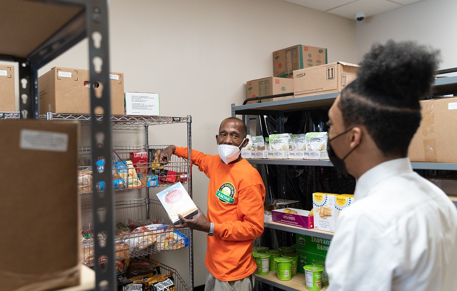 Jamil Wright and Darren Jeters talk about promoting healthy food at the Food and Wellness Center.