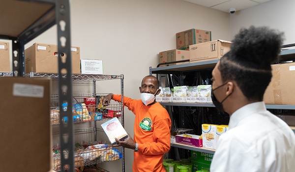 Jamil Wright and Darren Jeters talk about promoting healthy food at the Food and Wellness Center.