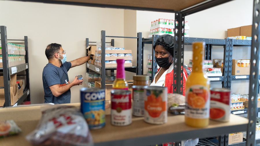 Marlene Black, at right, turns to the new Food and Wellness Center to help feed her grandchildren.