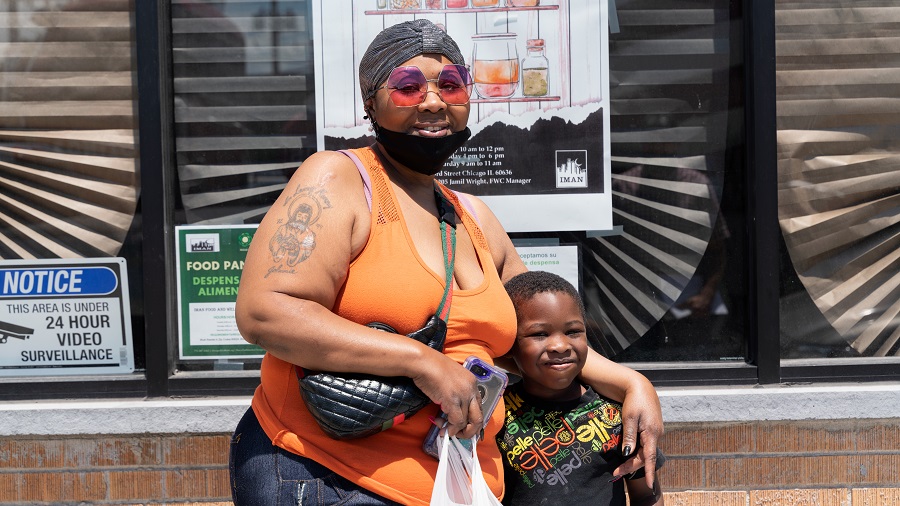 Sataria Martin with her son, Artsean, visit the IMAN Food and Wellness Center.