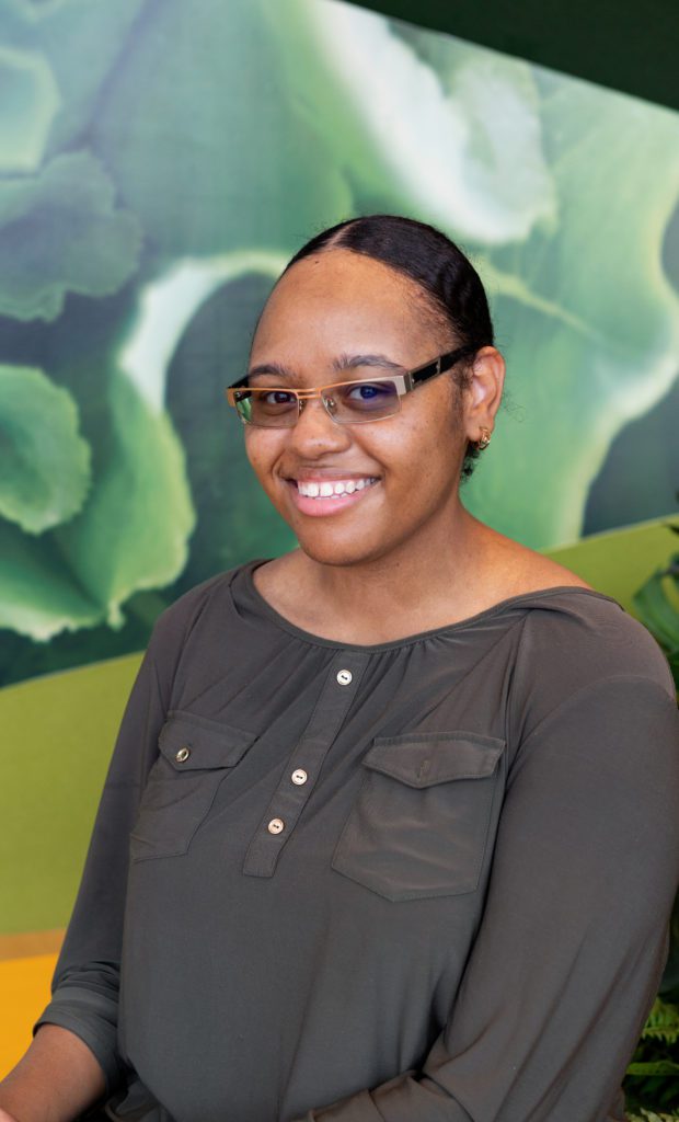 Briana Brewer posed for a photo at the Food Depository