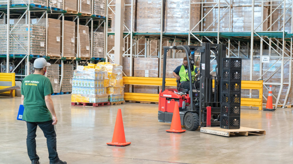 Student Rachel Tchamko receives forklift training as part of her warehouse job training program. (Photo by Kenneth Johnson for the Food Depository)