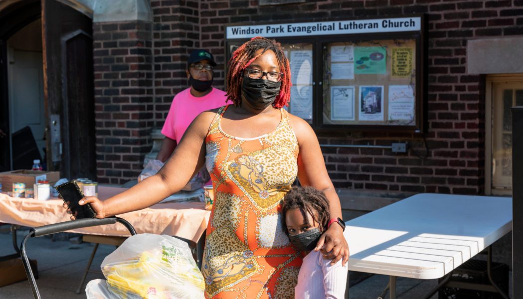 Kaneisha Jackson and her six-year-old daughter, Leilani, at the Windsor Park Lutheran Church food distribution.
