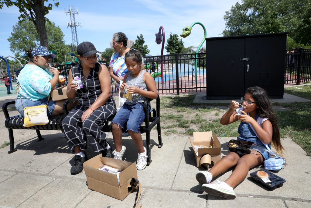 Sisters (from left) Melissa Alonso, 17, Giselle Moreno, 7, and Kayla Moreno, 11, visited the Lunch Bus with their mother and grandmother. 