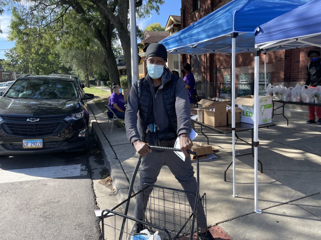Leonard Bryant picks up groceries at the All Things Through Christ food pantry.