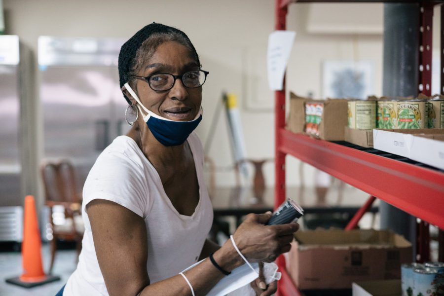 Linda Norris picks up groceries at the Above and Beyond food pantry