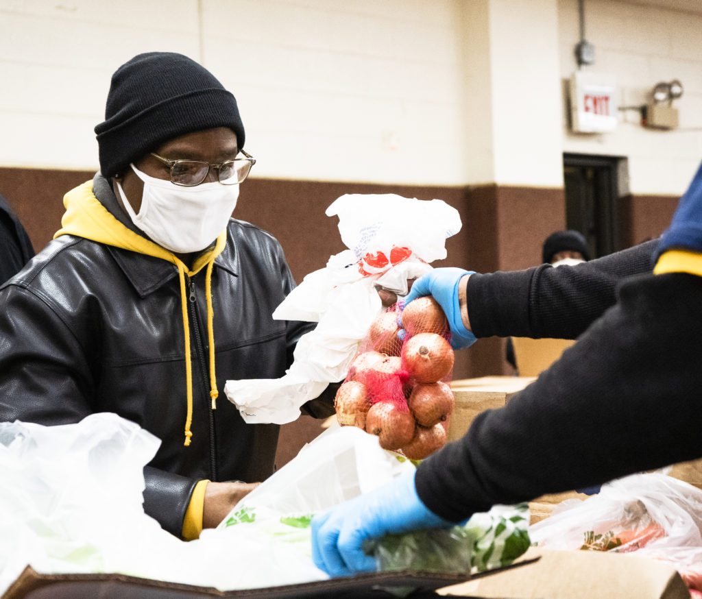 David Morris picks out food at the Coppin food pantry.