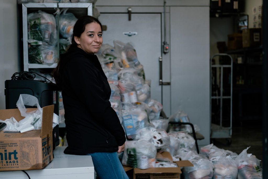 Volunteer Araceli Pizano at Sanad Social Services food pantry 